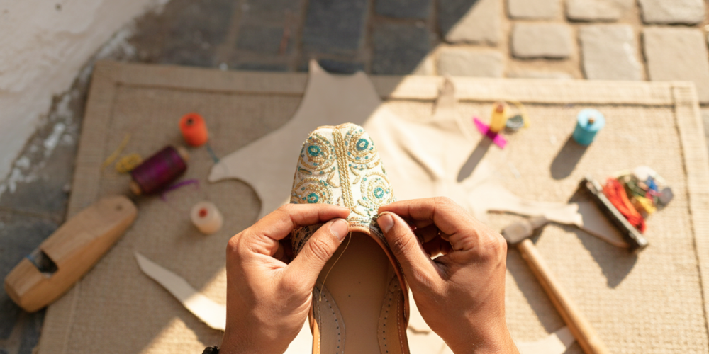 Artisan hand stitching an embroidered jutti — a traditional craft experience and one of the best things to do in Jodhpur