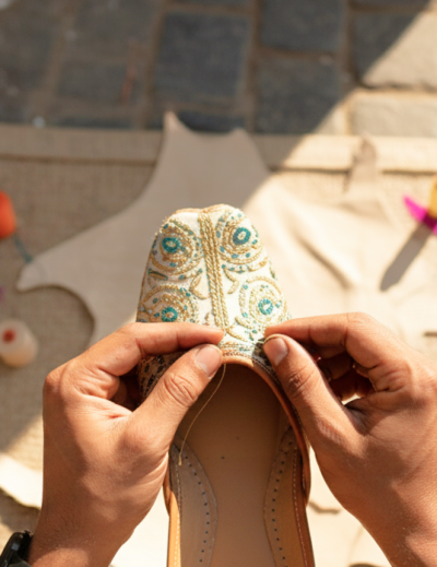 Artisan hand stitching an embroidered jutti — a traditional craft experience and one of the best things to do in Jodhpur thumbnail