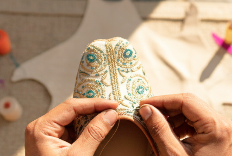 Artisan hand stitching an embroidered jutti — a traditional craft experience and one of the best things to do in Jodhpur thumbnail