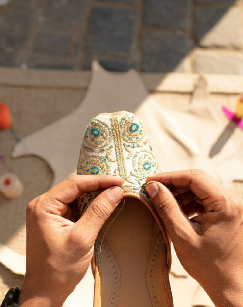 Artisan hand stitching an embroidered jutti — a traditional craft experience and one of the best things to do in Jodhpur thumbnail