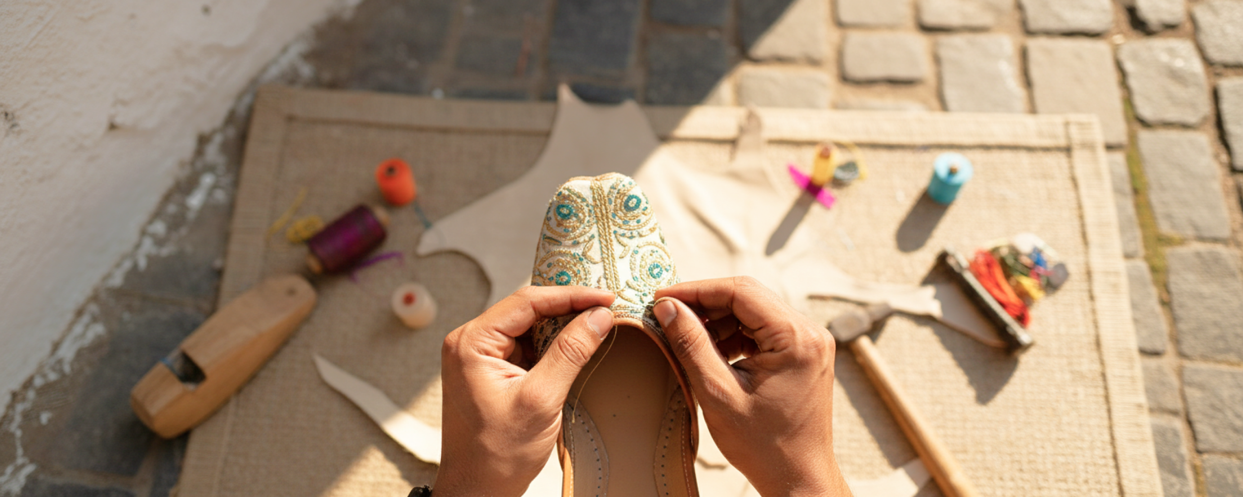 Artisan hand stitching an embroidered jutti — a traditional craft experience and one of the best things to do in Jodhpur