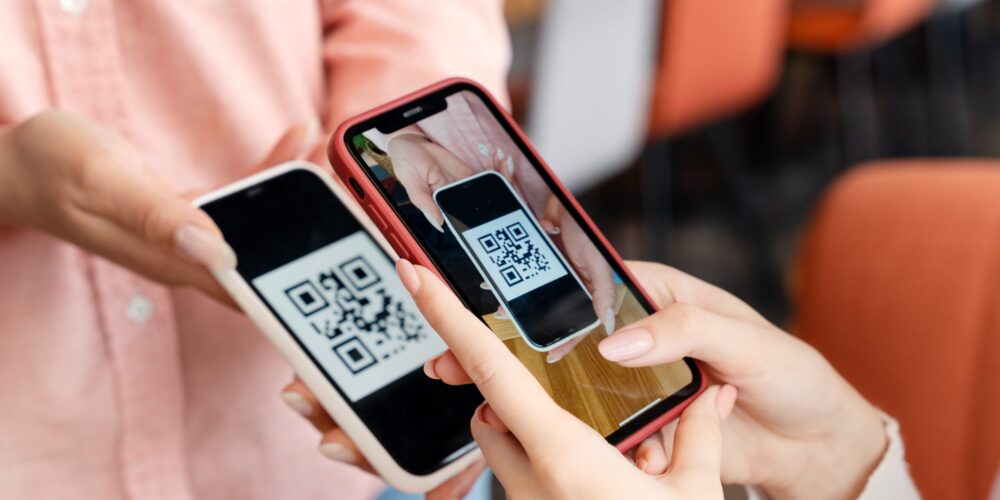 close up people using smartphones restaurant 1 scaled