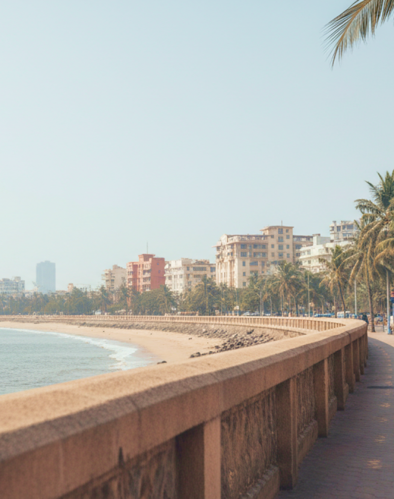 Marine Drive promenade on a Mumbai itinerary — palm lined seafront walkway with the Arabian Sea and city skyline in the background thumbnail