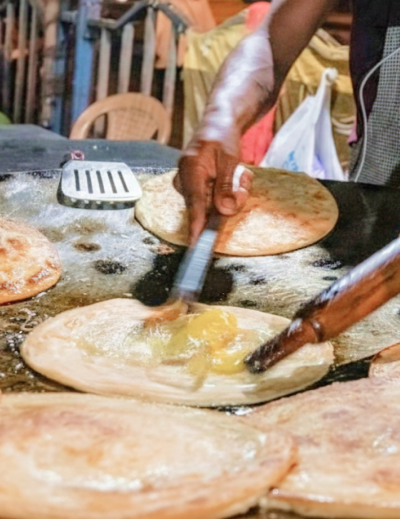Fresh kathi rolls being cooked at a Kolkata street stall