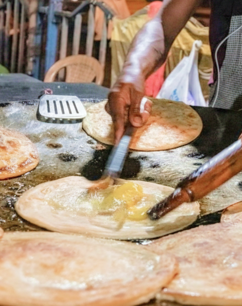Fresh kathi rolls being cooked at a Kolkata street stall