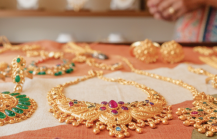 Traditional gold necklaces and earrings in a Kolkata jewelry shop