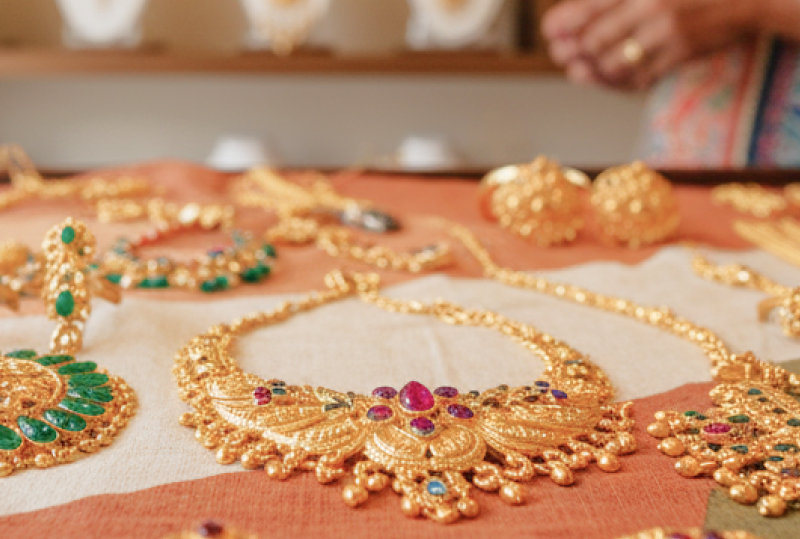 Traditional gold necklaces and earrings in a Kolkata jewelry shop