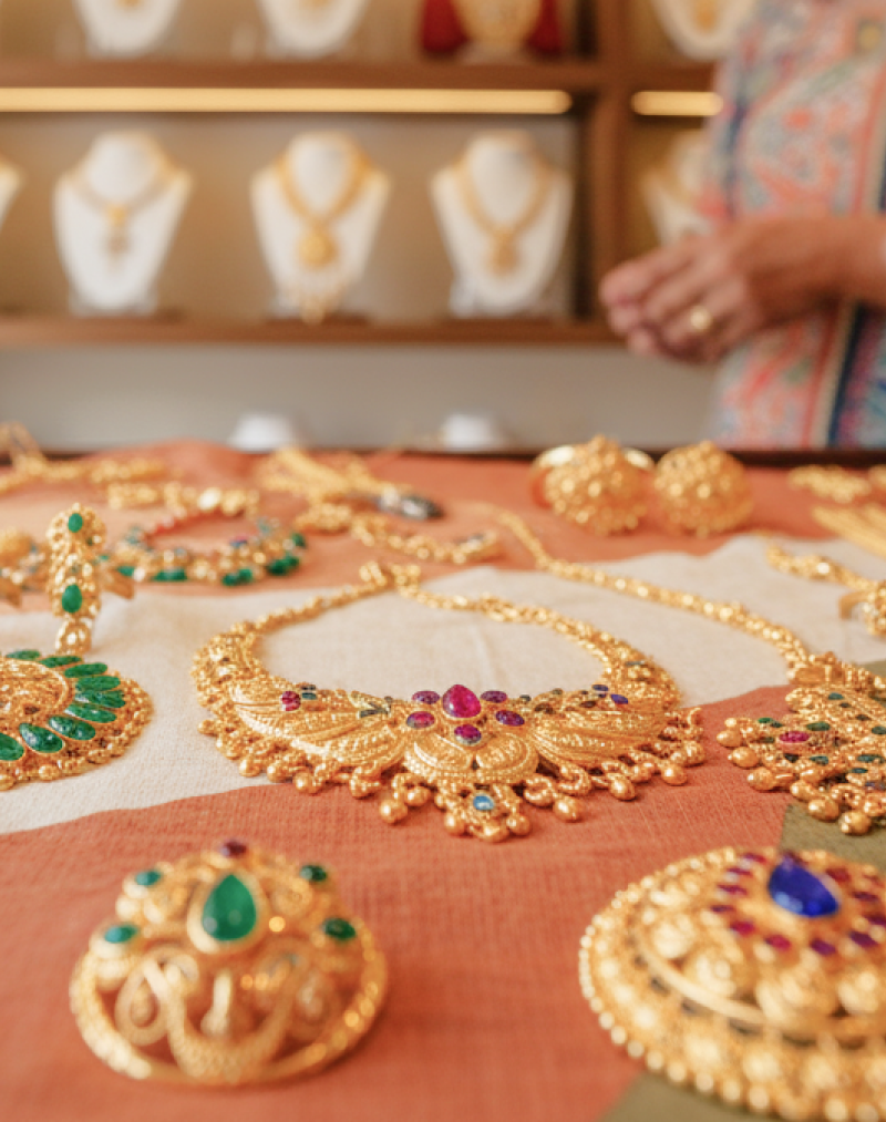 Traditional gold necklaces and earrings in a Kolkata jewelry shop