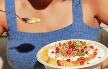 Indian doi parfait topped with pomegranate and nuts