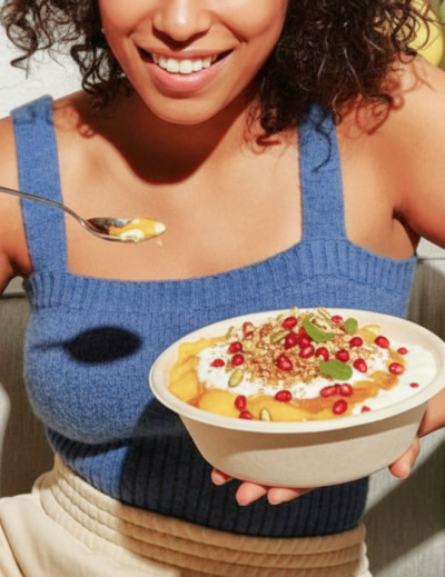 Indian doi parfait topped with pomegranate and nuts