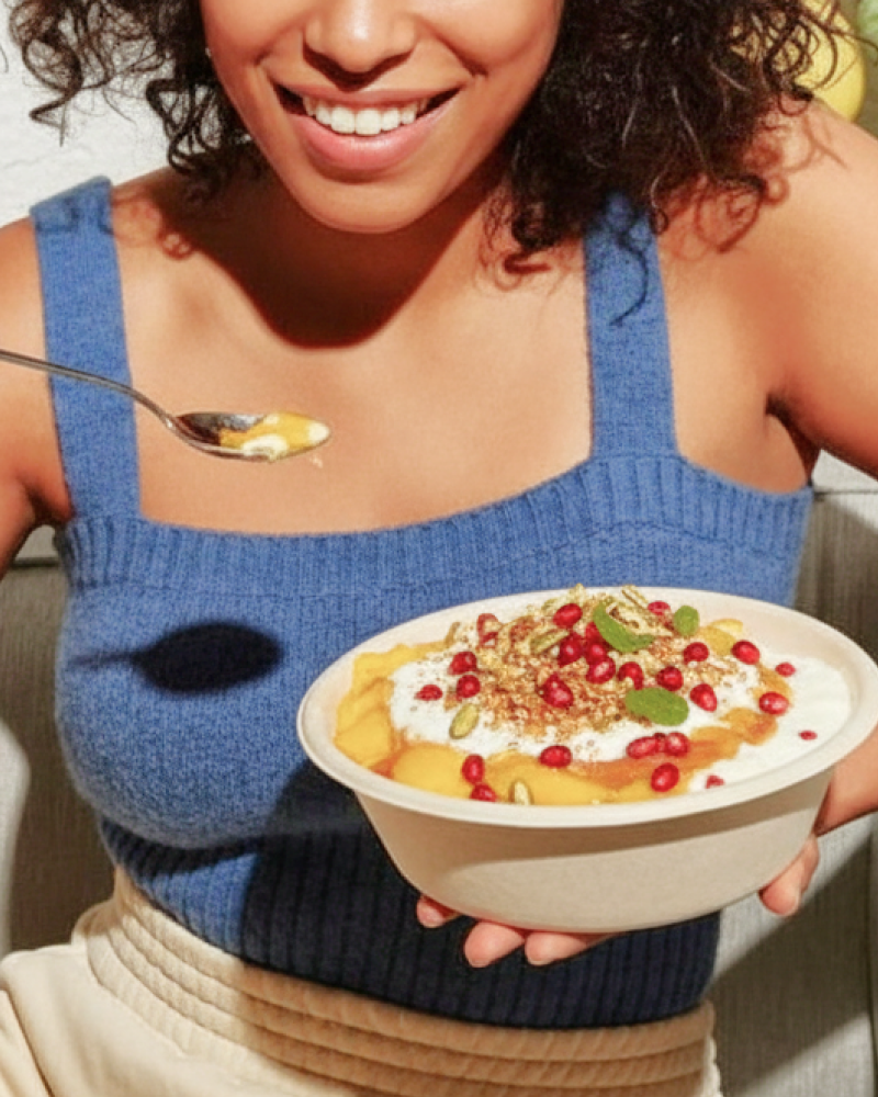 Indian doi parfait topped with pomegranate and nuts