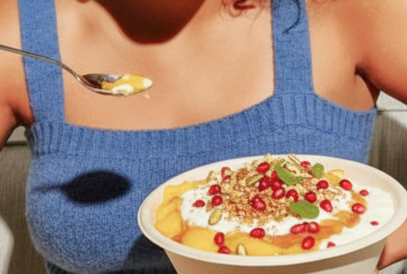 Indian doi parfait topped with pomegranate and nuts