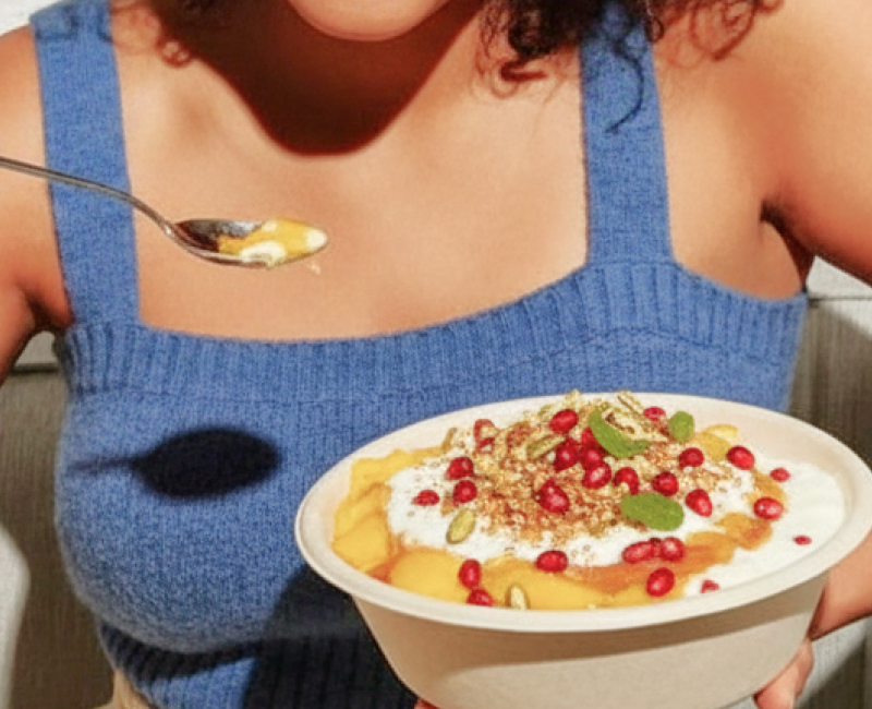 Indian doi parfait topped with pomegranate and nuts