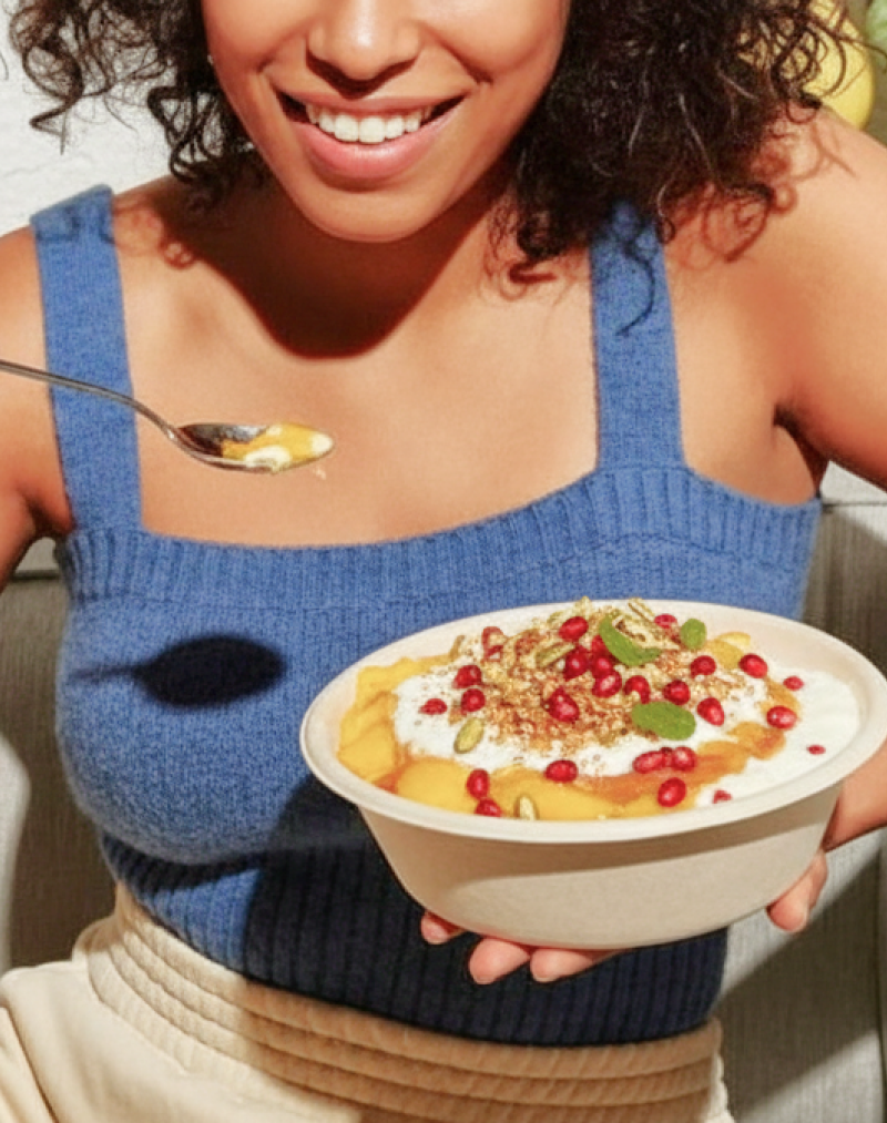 Indian doi parfait topped with pomegranate and nuts