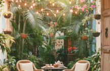 Best places to stay in Pondicherry — a charming boutique guesthouse courtyard with fairy lights, bougainvillea, and rattan chairs in the French Quarter thumbnail