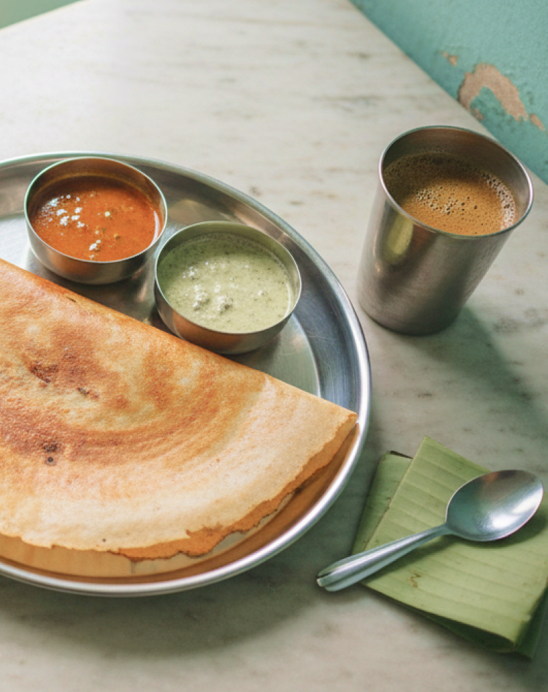 A masala dosa served in a steel thali with sambar and coconut chutney at a traditional Chennai tiffin shop, where to eat in Chennai for an authentic South Indian breakfast thumbnail