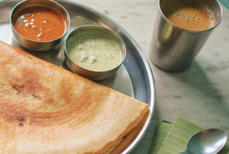 A masala dosa served in a steel thali with sambar and coconut chutney at a traditional Chennai tiffin shop, where to eat in Chennai for an authentic South Indian breakfast thumbnail