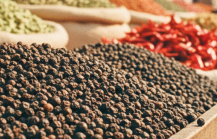 Colourful spice stalls piled with black pepper, cardamom, and dried chilli at a Kochi market — essential stops when exploring where to eat in Kochi thumbnail