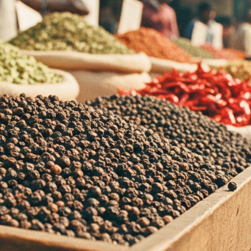 Colourful spice stalls piled with black pepper, cardamom, and dried chilli at a Kochi market — essential stops when exploring where to eat in Kochi thumbnail