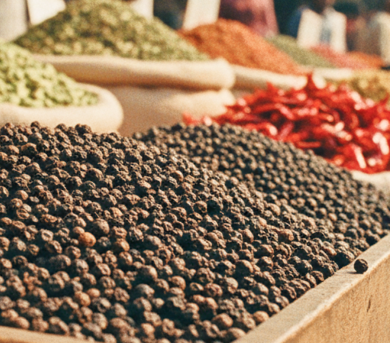 Colourful spice stalls piled with black pepper, cardamom, and dried chilli at a Kochi market — essential stops when exploring where to eat in Kochi thumbnail