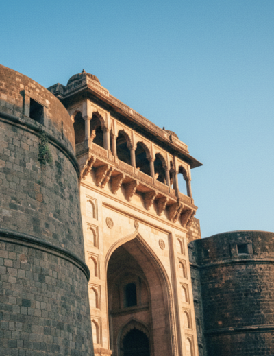 Low angle view of Shaniwar Wada's rounded bastion and colonnaded gateway at golden hour — an iconic landmark in any Pune travel guide thumbnail
