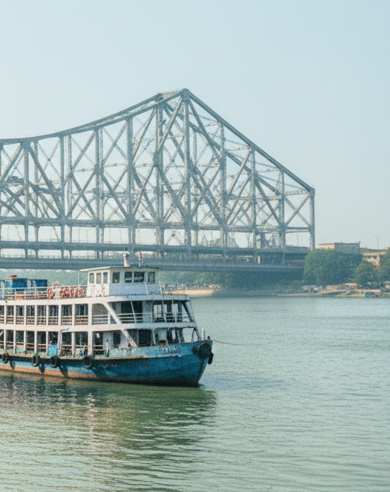 Passenger ferries moored on the Hooghly River with Howrah Bridge in the background, Kolkata travel guide thumbnail