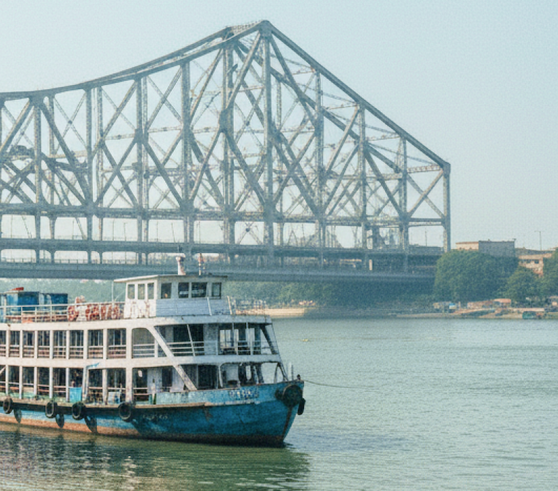Passenger ferries moored on the Hooghly River with Howrah Bridge in the background, Kolkata travel guide thumbnail